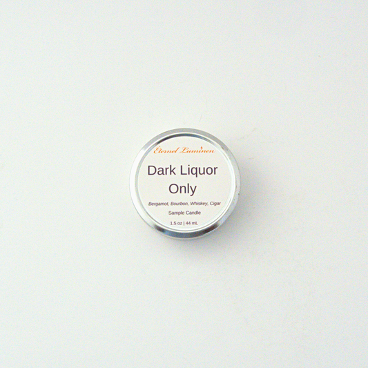 A 1.5oz Dark Liquor Only  sample candle in a tin jar sitting against a white background made by Eternel Luminen