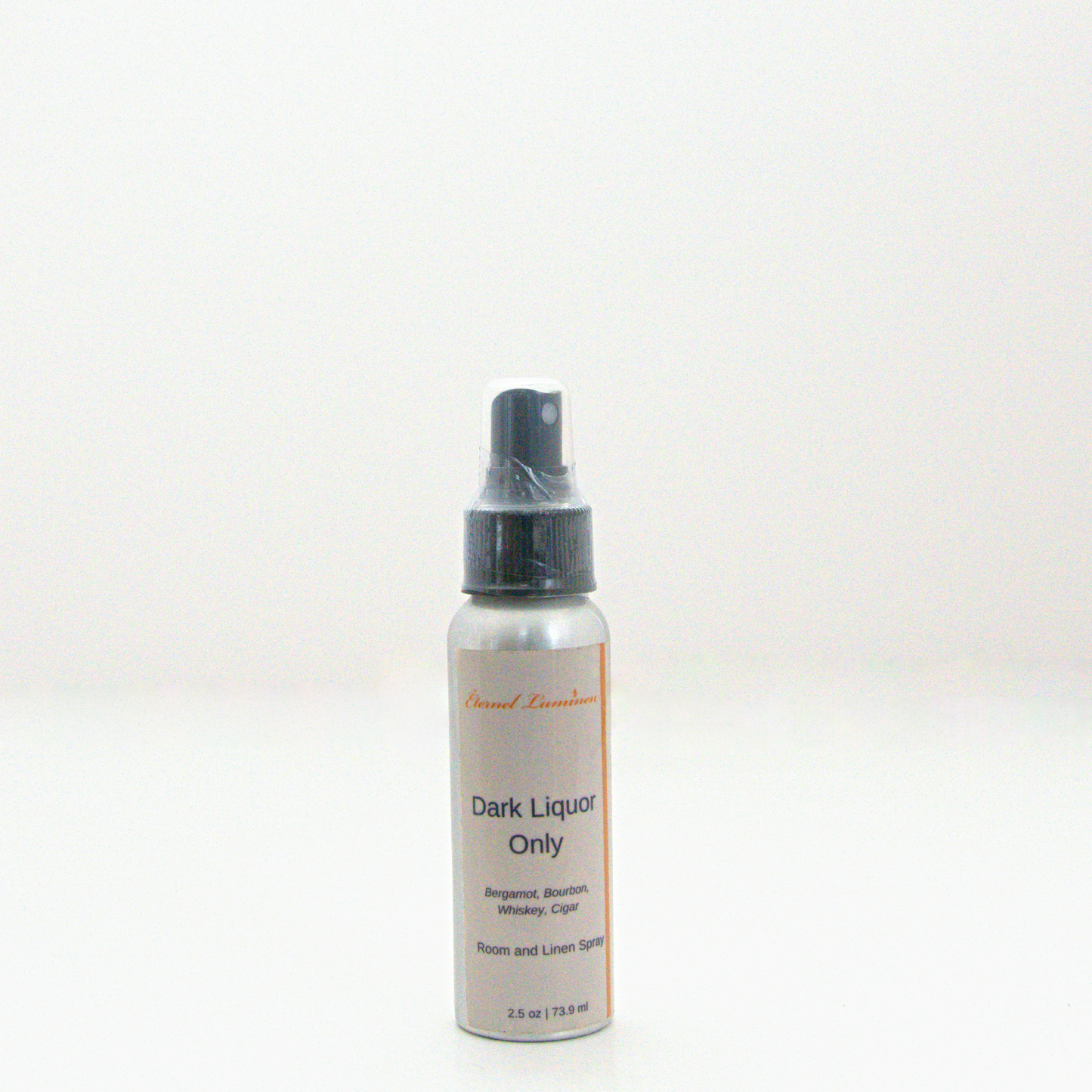 A 2.5 oz Dark Liquor Only room & linen spray sitting against a white background made by Eternel Luminen.