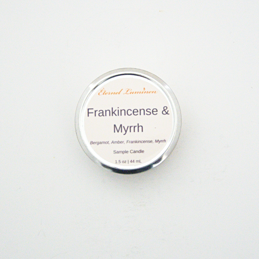 A 1.5oz Frankincense & Myrrh sample candle in a tin jar sitting against a white background made by Eternel Luminen