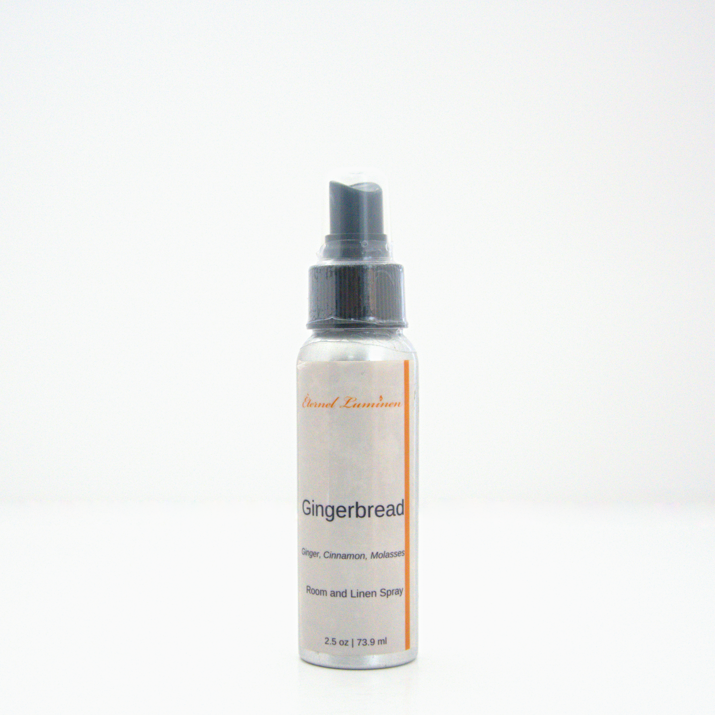 A 2.5oz Gingerbread room & linen spray sitting against a white background made by Eternel Luminen.