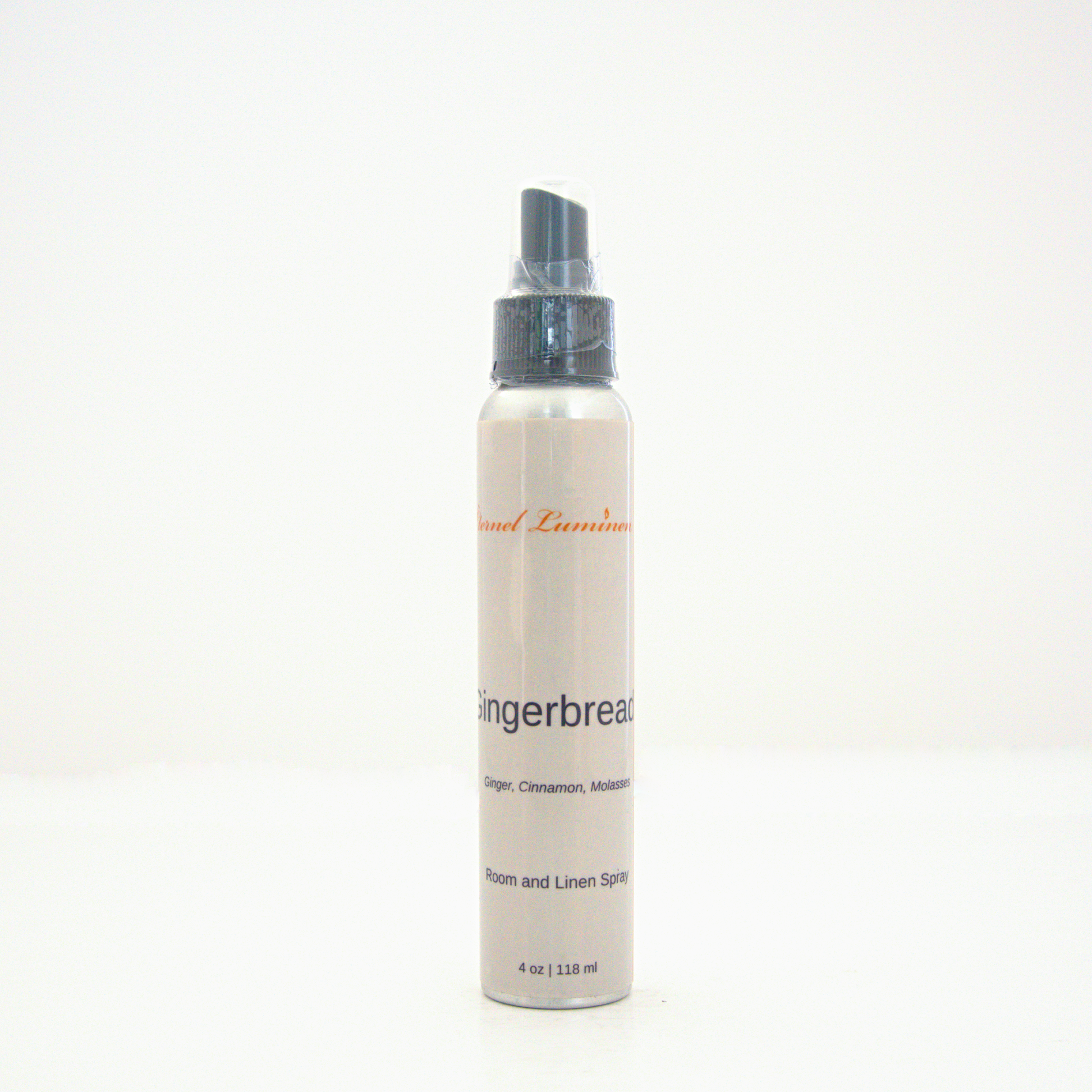 A 4oz Gingerbread room & linen spray sitting against a white background made by Eternel Luminen.