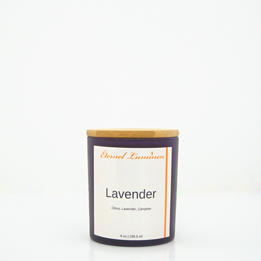 A 8 oz Lavender frosted candle with a wooden lid sitting against a white background made by Eternel Luminen.