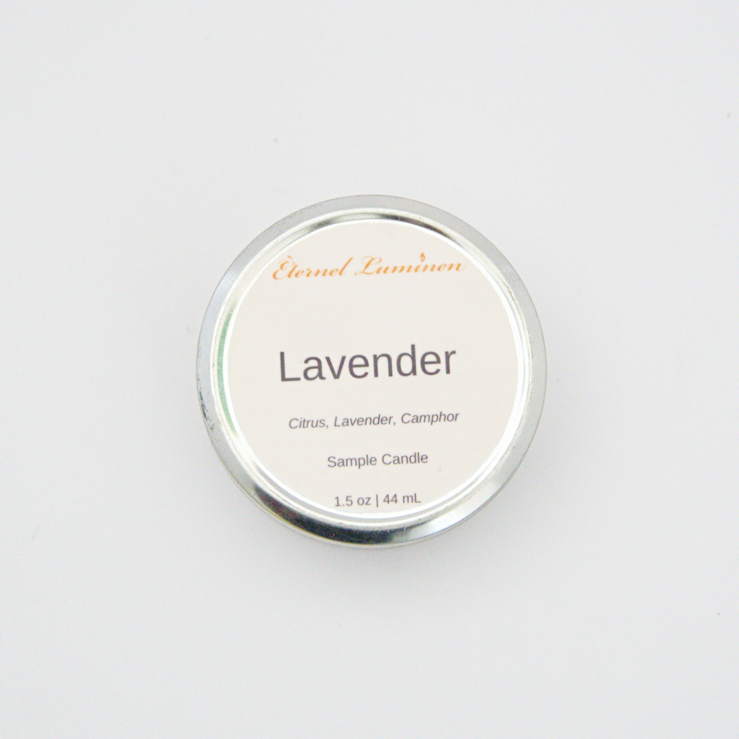 A 1.5oz Lavender sample candle in a tin jar sitting against a white background