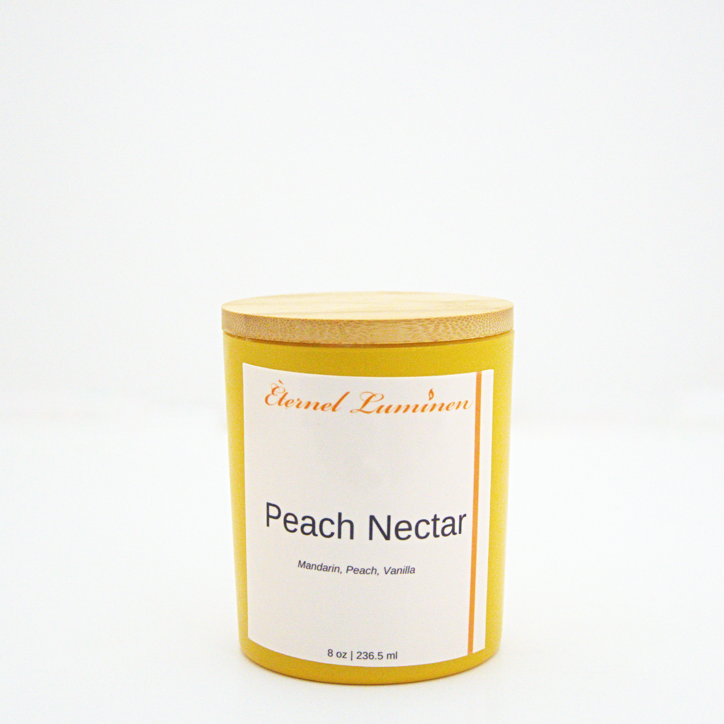 A 8 oz Peach Nectar frosted candle with a wooden lid sitting against a white background made by Eternel Luminen.
