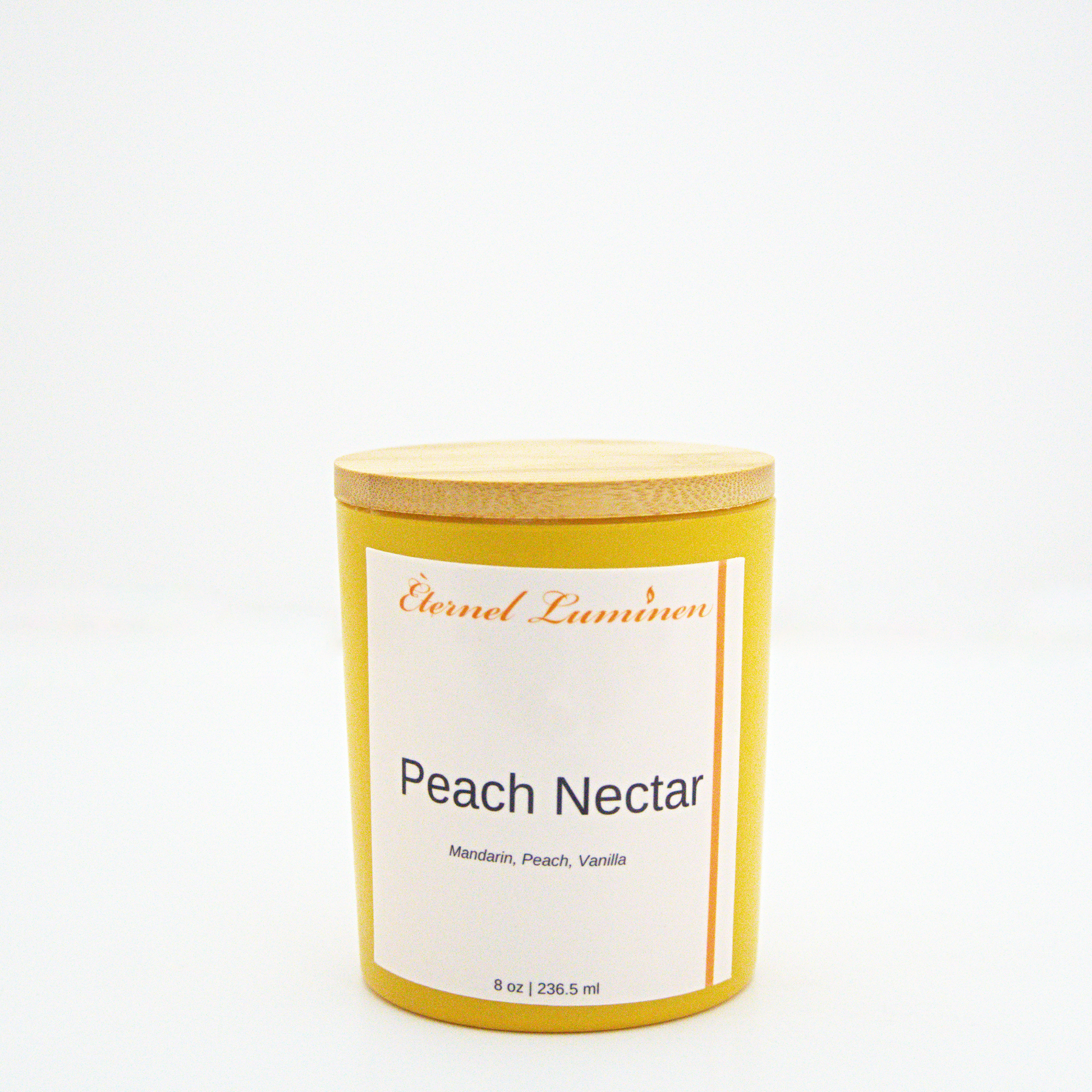 A 8 oz Peach Nectar frosted candle with a wooden lid sitting against a white background made by Eternel Luminen.