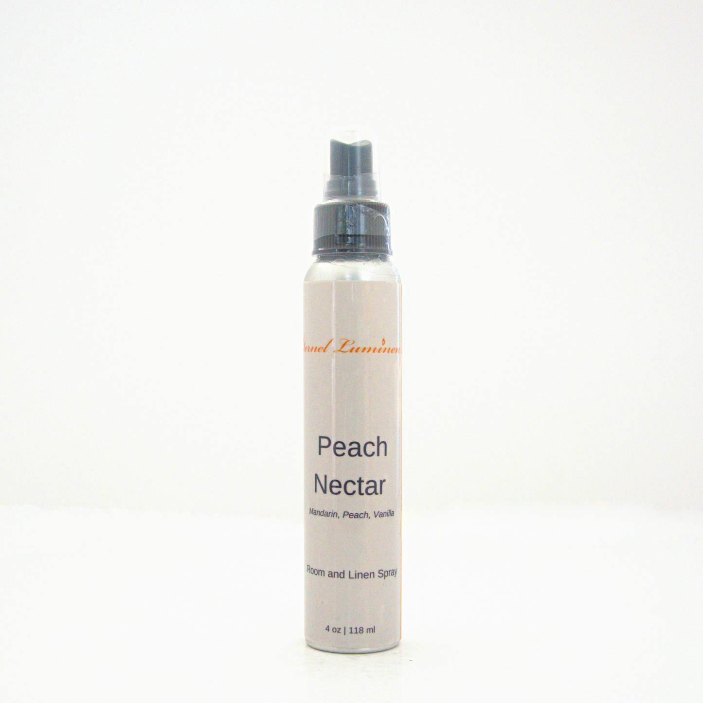 A 4oz Peach Nectar room & linen spray sitting against a white background made by Eternel Luminen.