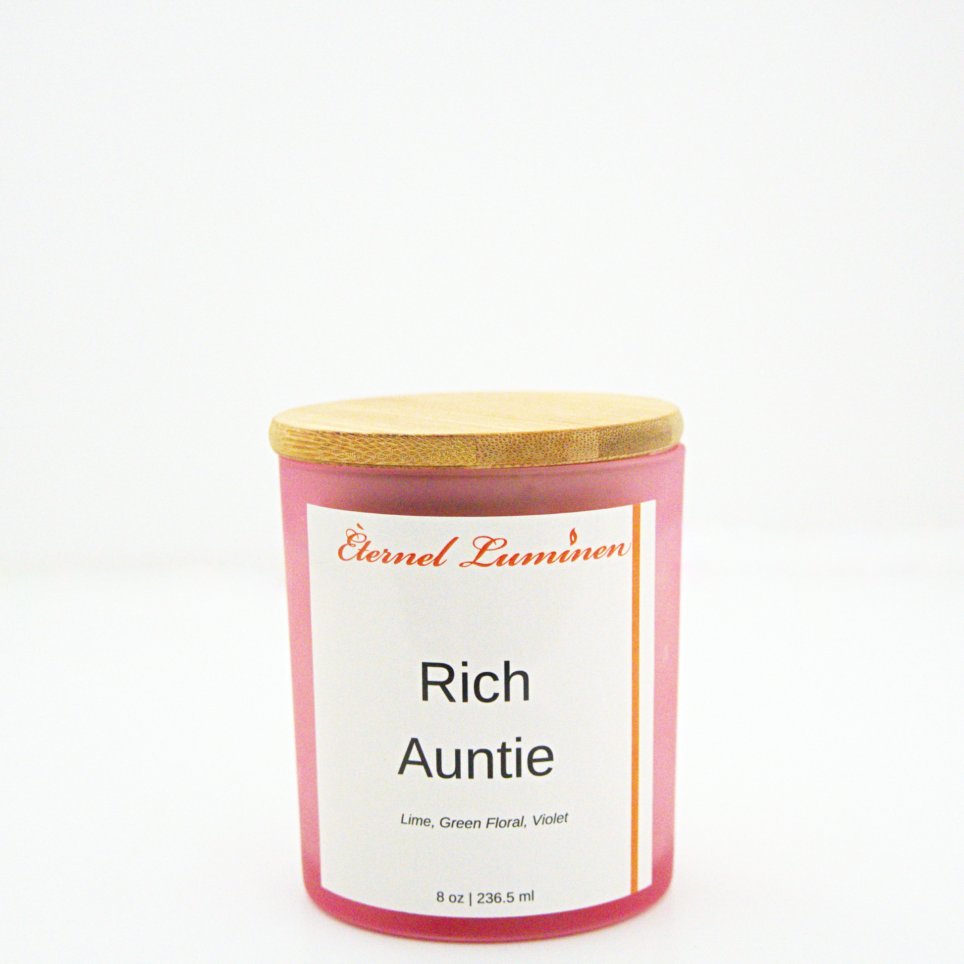 A 8 oz frosted Rich Auntie candle with a wooden lid sitting against a white background made by Eternel Luminen.