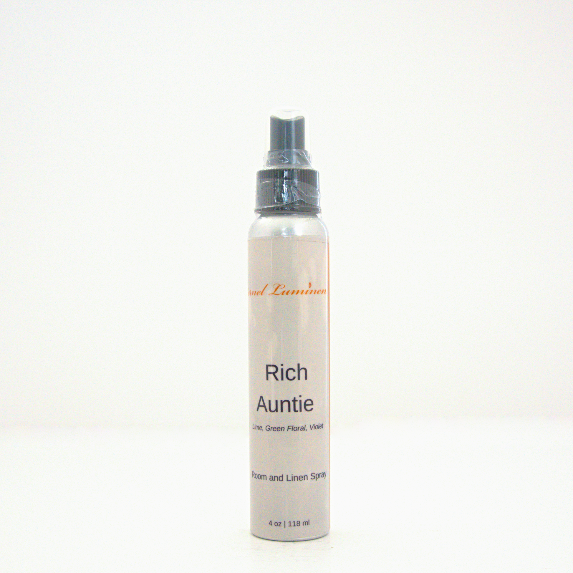 A 4oz Rich Auntie room & linen spray sitting against a white background made by Eternel Luminen.