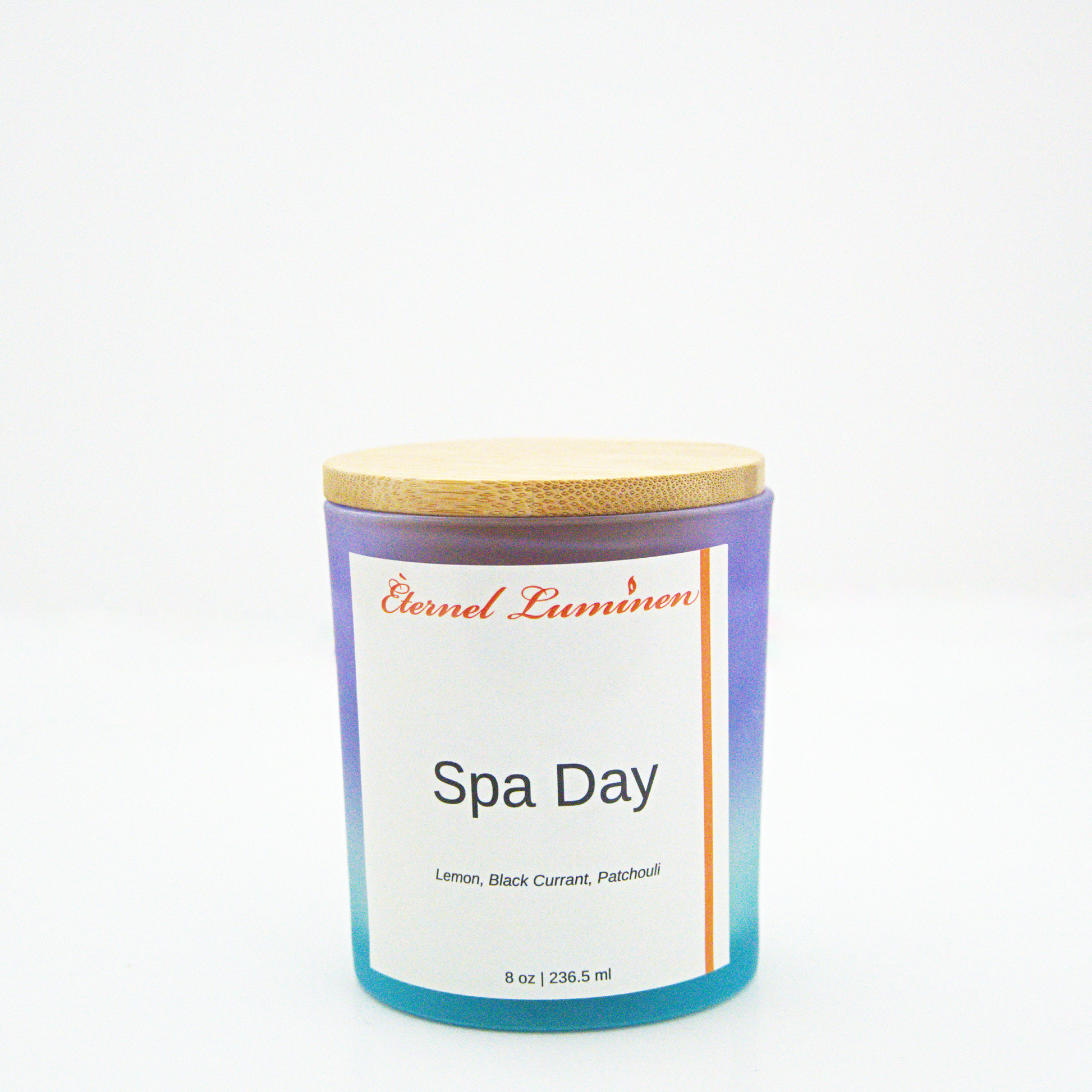 A 8oz spa day frosted candle with a wooden lid sitting against a white background made by Eternel Luminen.