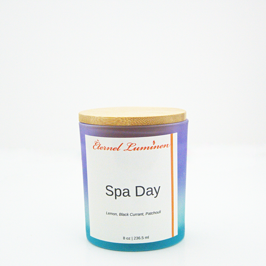 A 8oz spa day frosted candle with a wooden lid sitting against a white background made by Eternel Luminen.