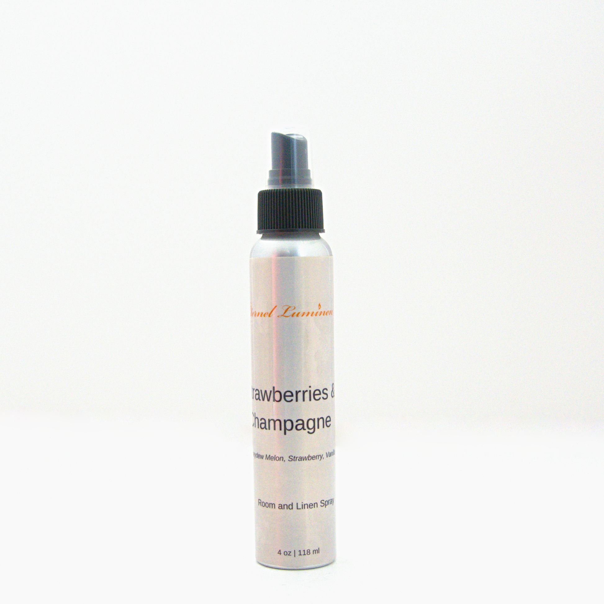 A 4oz Strawberries & Champagne room & linen spray sitting against a white background made by Eternel Luminen.