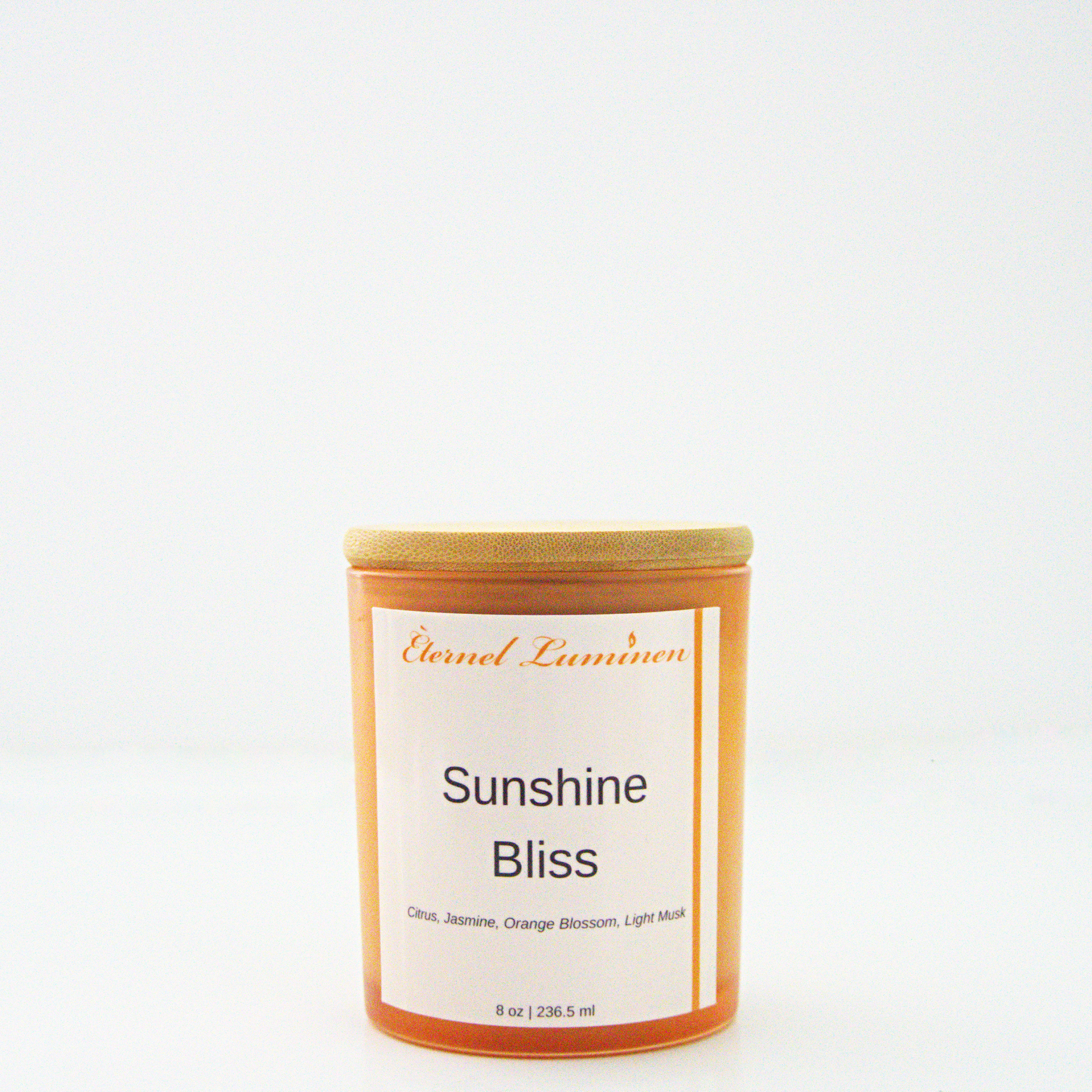 A 8 oz frosted Sunshine Bliss candle with a wooden lid sitting against a white background made by Eternel Luminen.