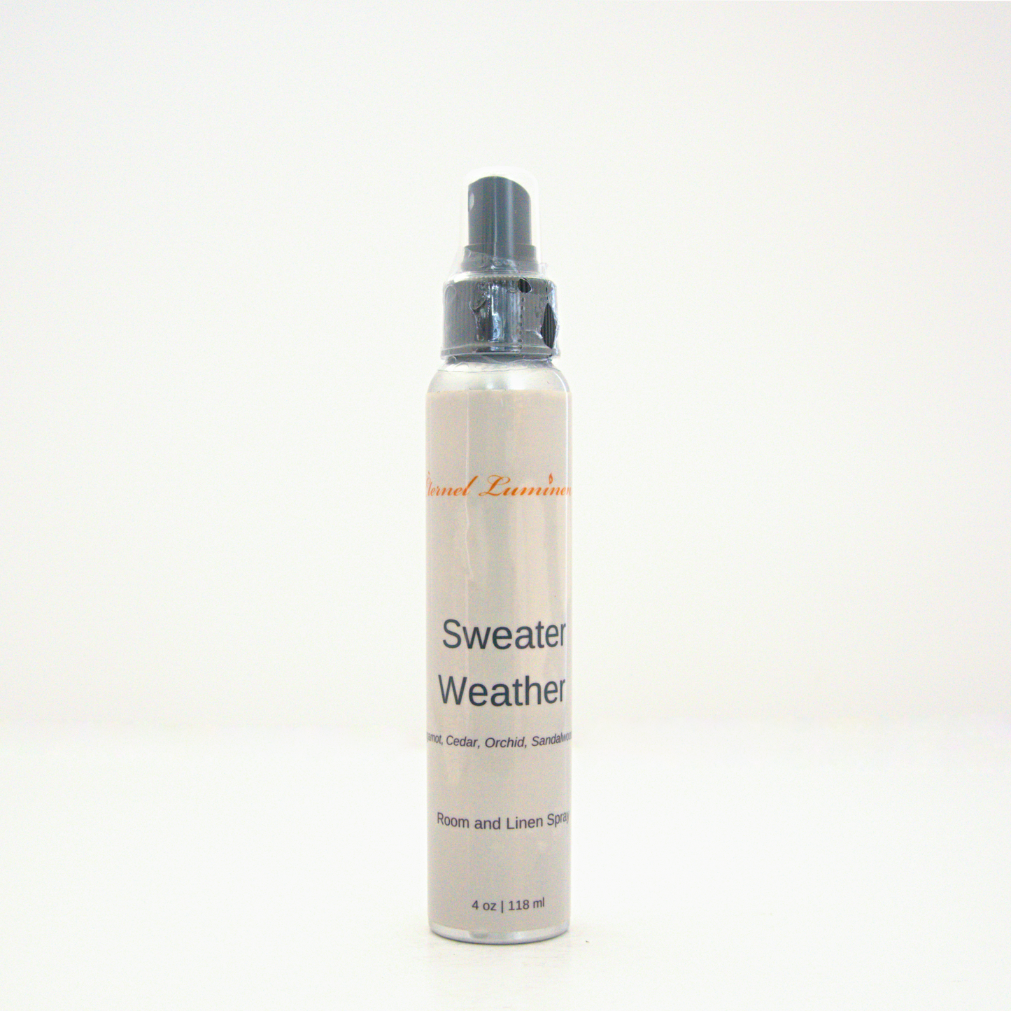 A 4oz Sweater Weather room & linen spray sitting against a white background made by Eternel Luminen.