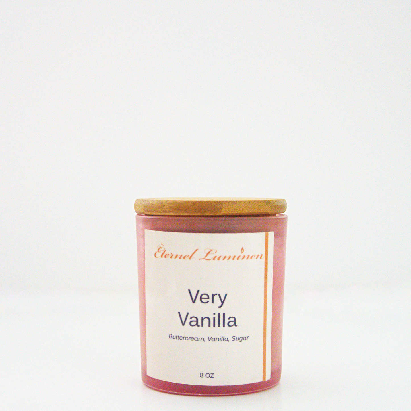 A 8 oz frosted Very Vanilla candle with a wooden lid sitting against a white background made by Eternel Luminen.