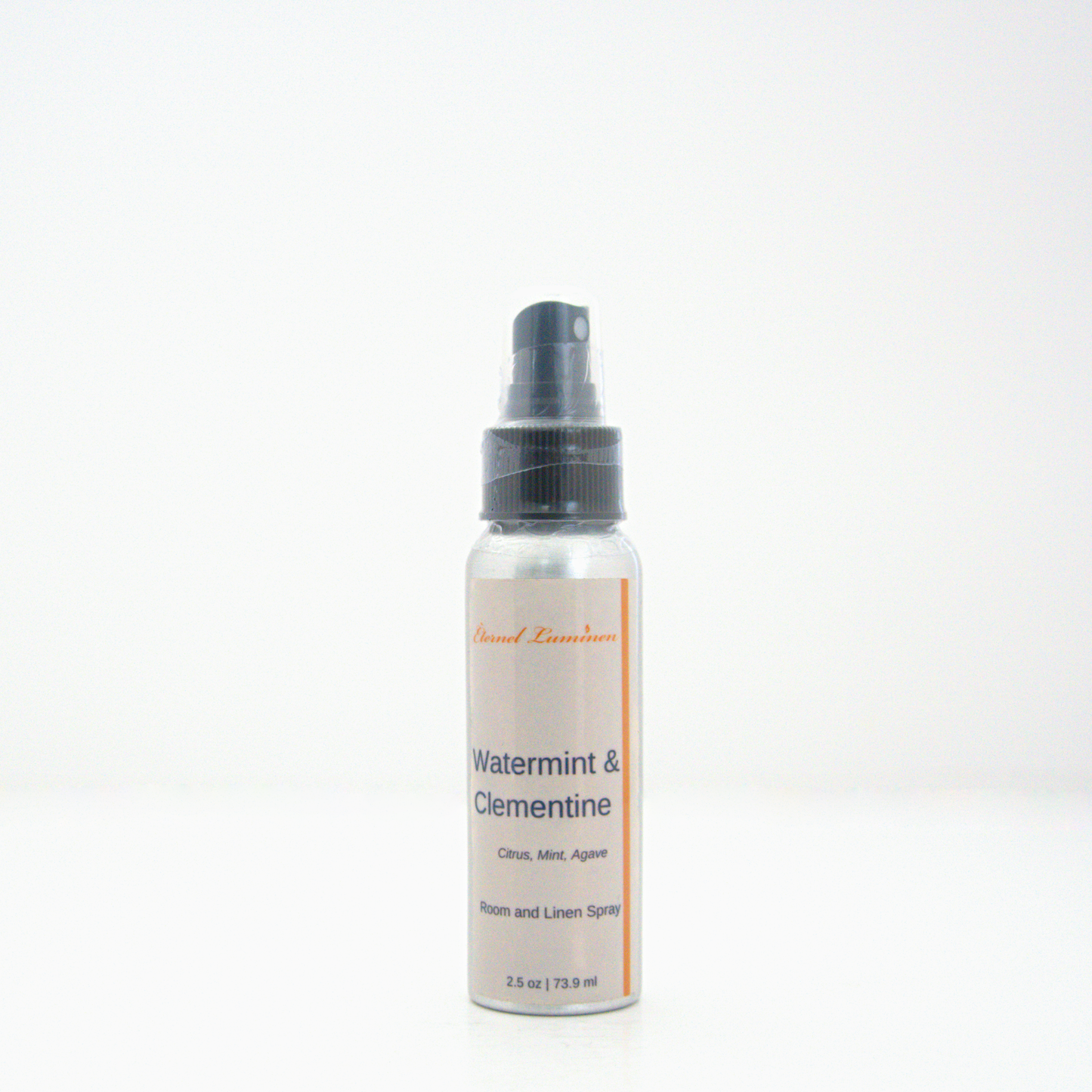A 2.5oz Watermint & Clementine room & linen spray sitting against a white background made by Eternel Luminen.