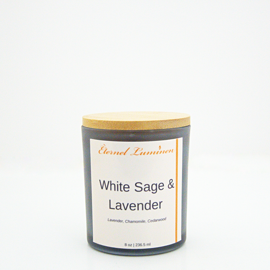 A 8 oz frosted White Sage & Lavender candle with a wooden lid sitting against a white background made by Eternel Luminen.