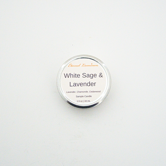 A 1.5oz White Sage & Lavender sample candle in a tin jar sitting against a white background made by Eternel Luminen