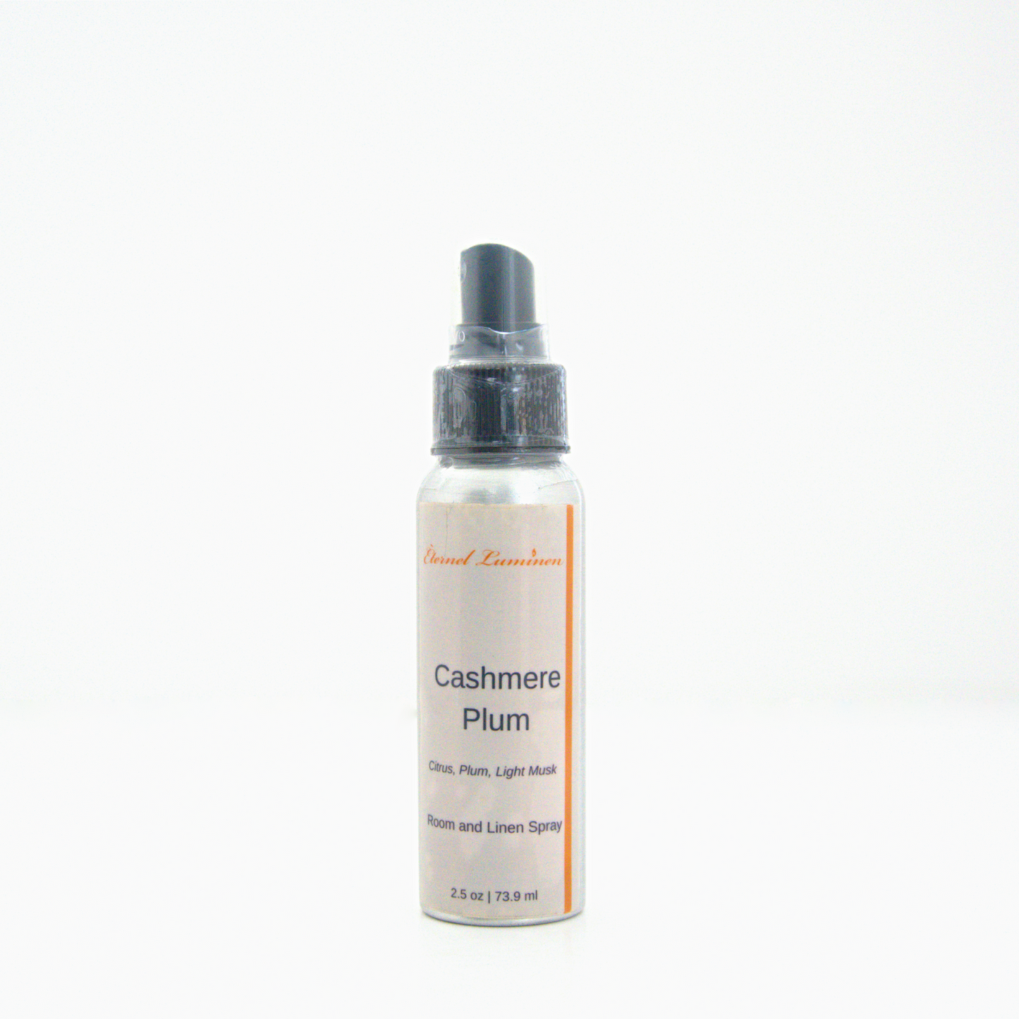 A 2.5oz Cashmere Plum room & linen spray sitting against a white background made by Eternel Luminen.