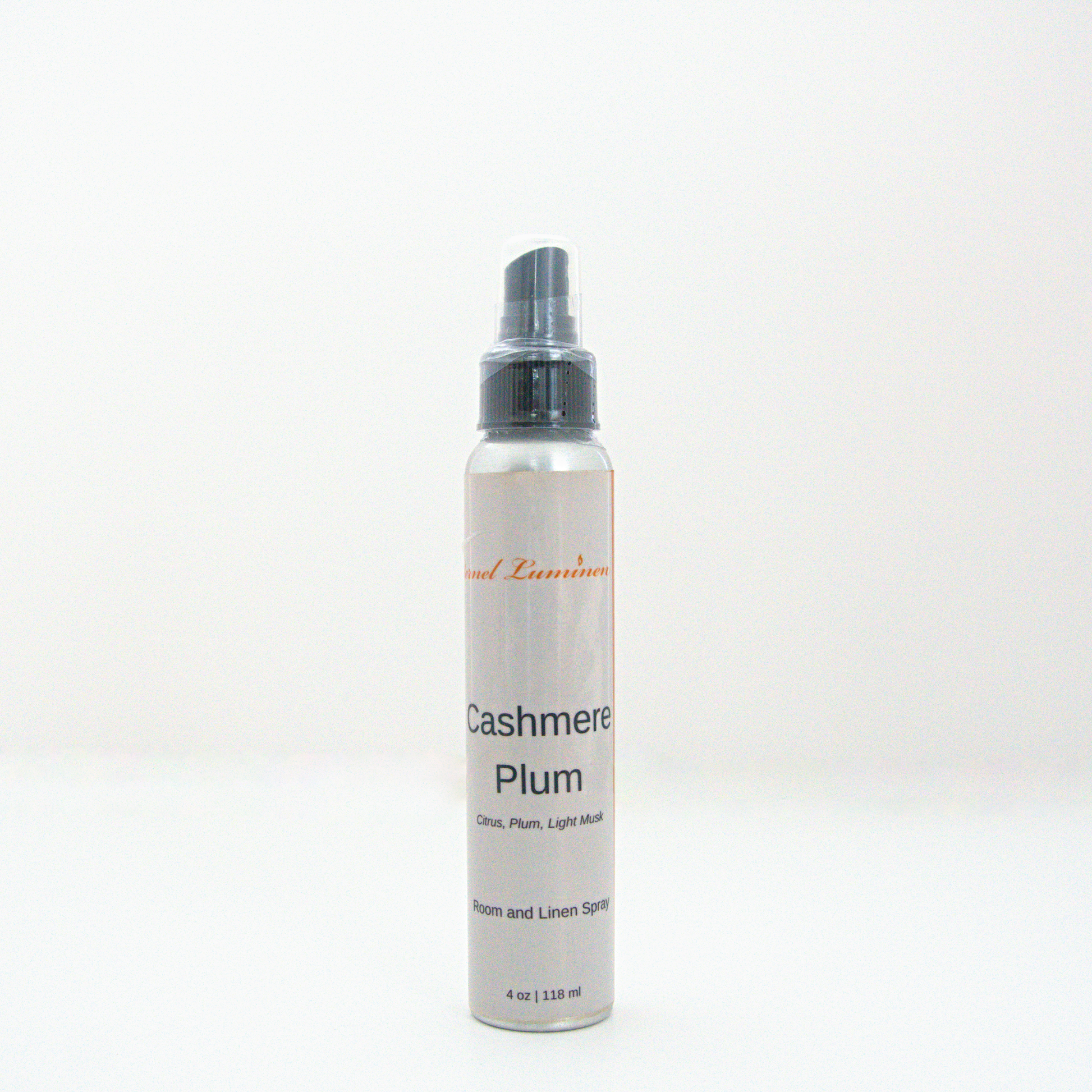 A 4oz Cashmere Plum room & linen spray sitting against a white background made by Eternel Luminen.