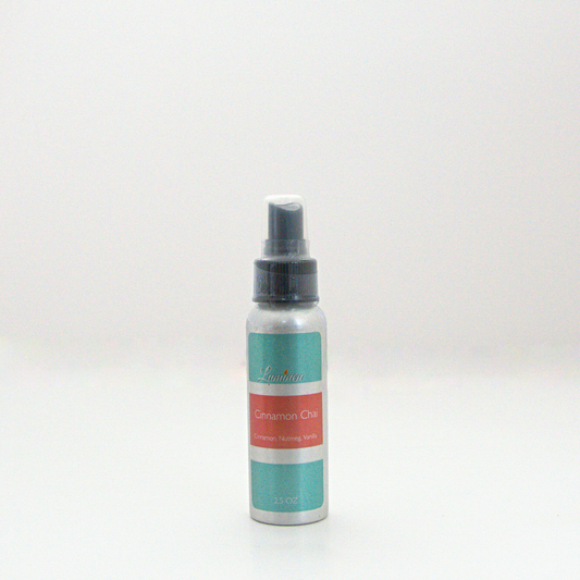 A 2.5oz Cinnamon Chai room & linen spray sitting against a white background made by Eternel Luminen.