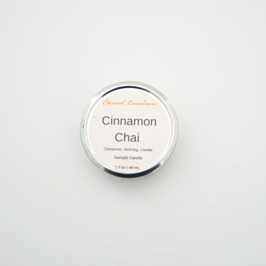 A 1.5oz Cinnamon Chai sample candle in a tin jar sitting against a white background made by Eternel Luminen
