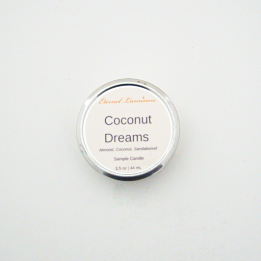 A 1.5oz Coconut Dreams sample candle in a tin jar sitting against a white background made by Eternel Luminen