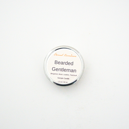 A 1.5oz Bearded Gentleman sample candle in a tin jar sitting against a white background made by Eternel Luminen