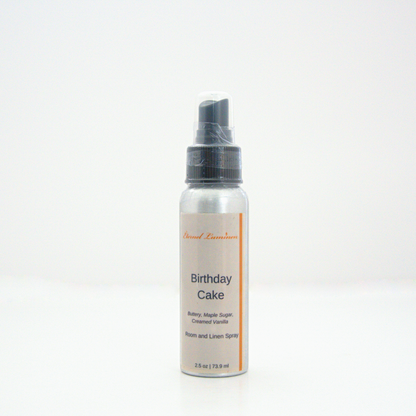 A 2.5oz Birthday Cake room & linen spray sitting against a white background made by Eternel Luminen.