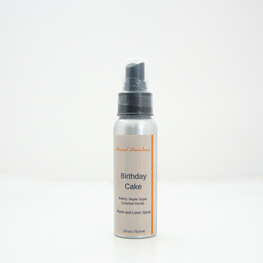 A 2.5oz Birthday Cake room & linen spray sitting against a white background made by Eternel Luminen.