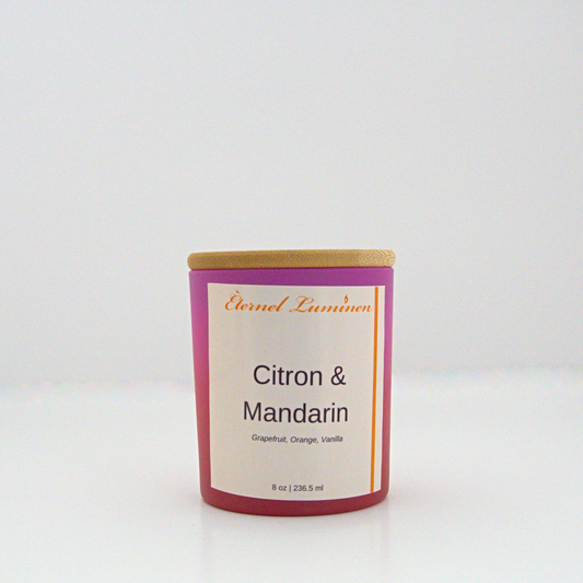 A 8 oz frosted Citron & Mandarin candle with a wooden lid sitting against a white background made by Eternel Luminen.