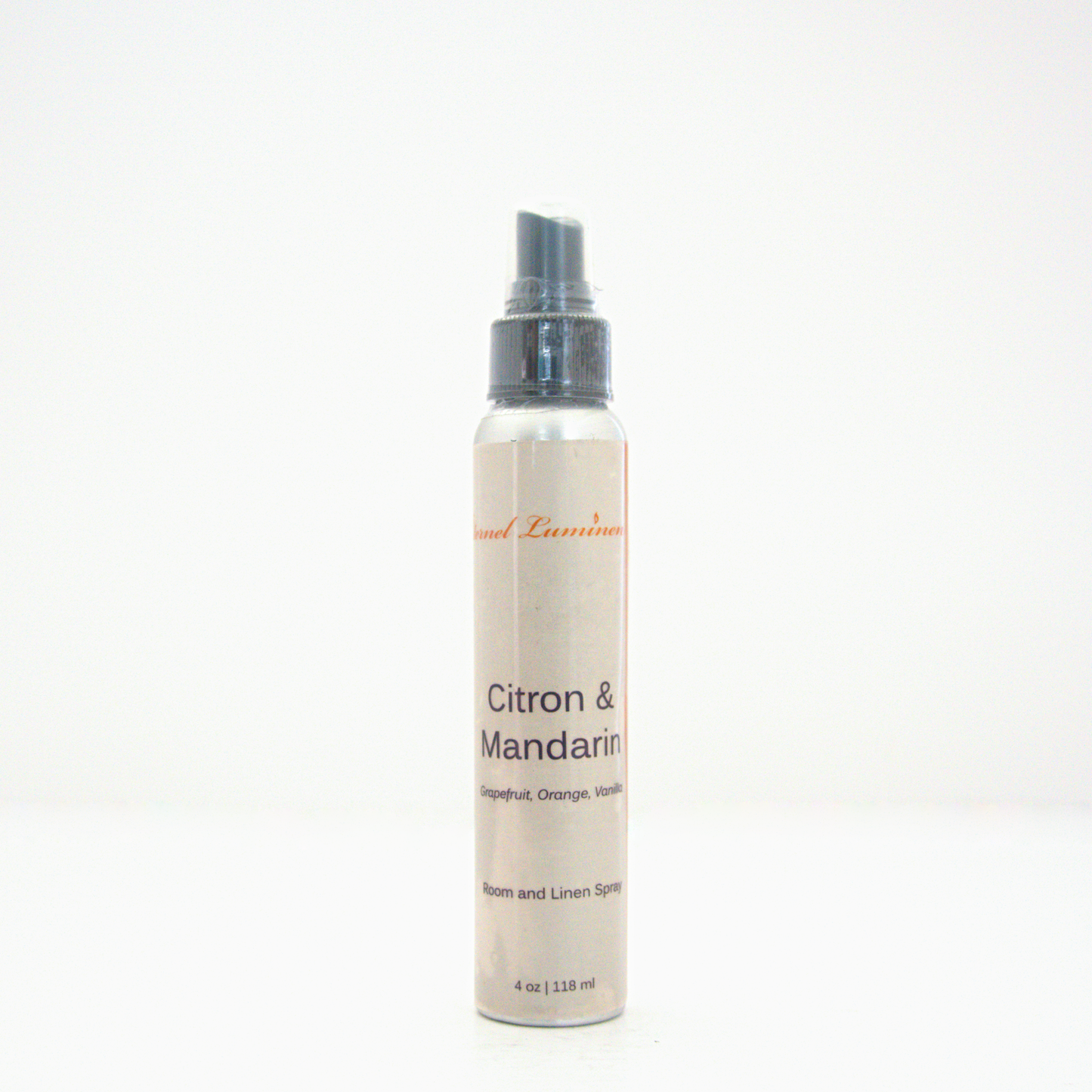 A 4oz Citron & Mandarin room & linen spray sitting against a white background made by Eternel Luminen.