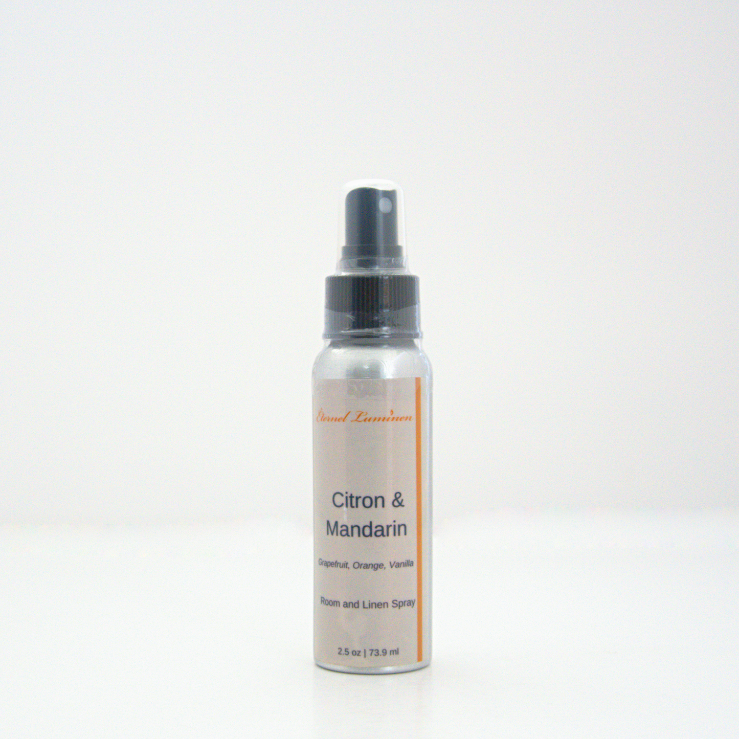 A 2.5oz Citron & Mandarin room & linen spray sitting against a white background made by Eternel Luminen.
