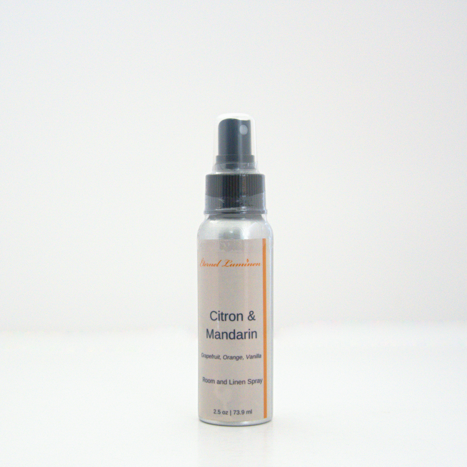 A 2.5oz Citron & Mandarin room & linen spray sitting against a white background made by Eternel Luminen.