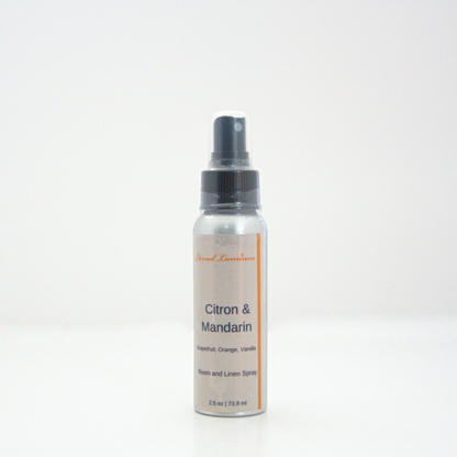 A 2.5oz Citron & Mandarin room & linen spray sitting against a white background made by Eternel Luminen.