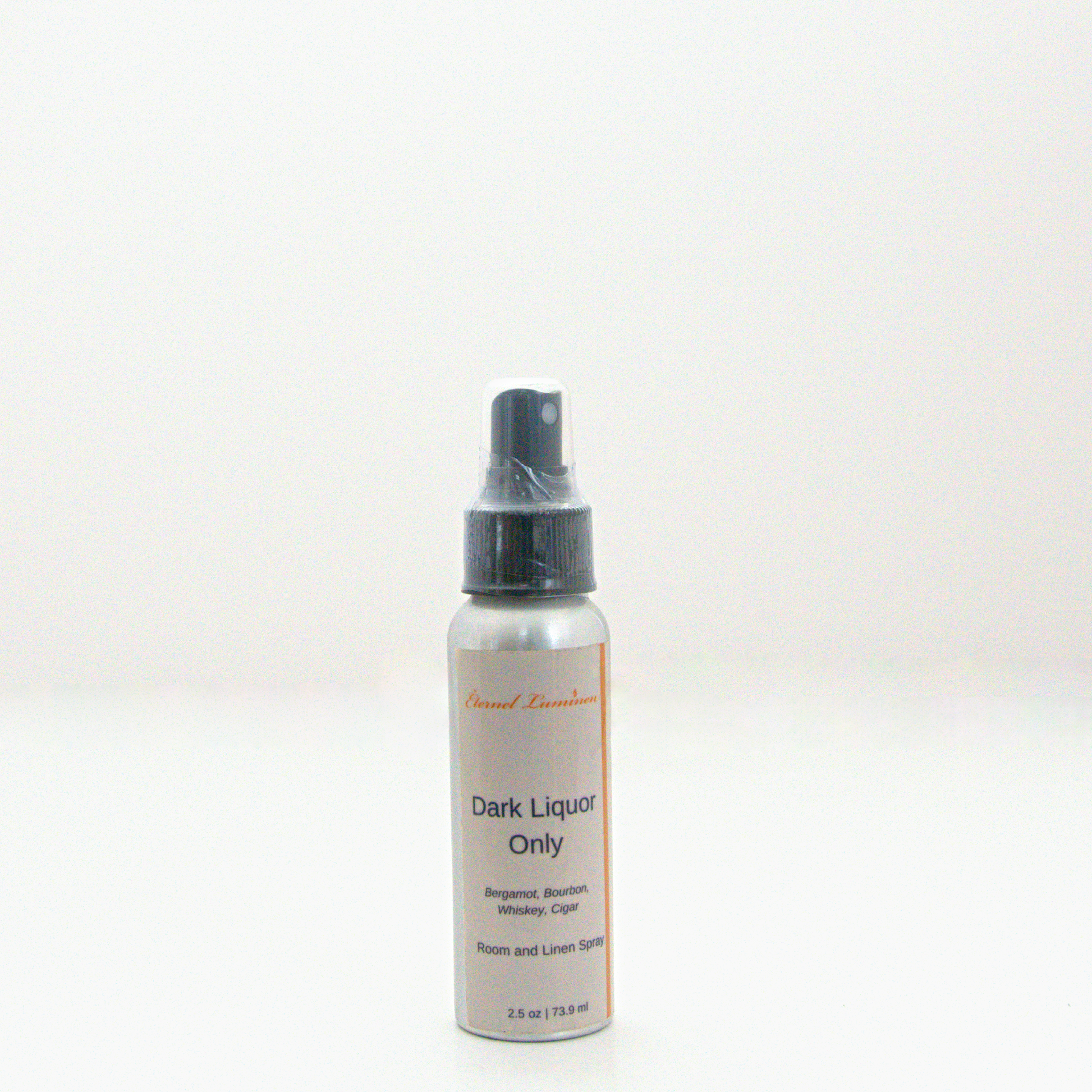 A 2.5 oz Dark Liquor Only room & linen spray sitting against a white background made by Eternel Luminen. 