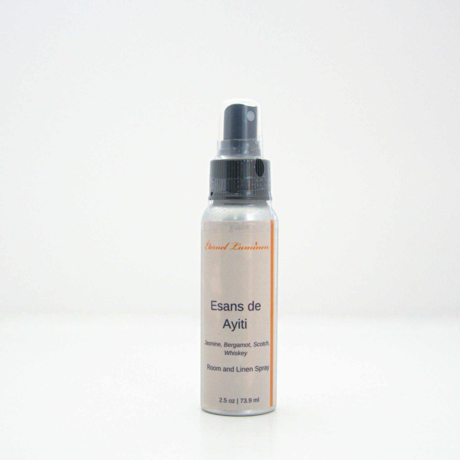 A 2.5oz Esans de Ayiti room & linen spray sitting against a white background made by Eternel Luminen.