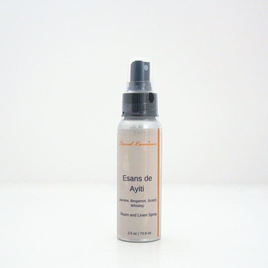 A 2.5oz Esans de Ayiti room & linen spray sitting against a white background made by Eternel Luminen.