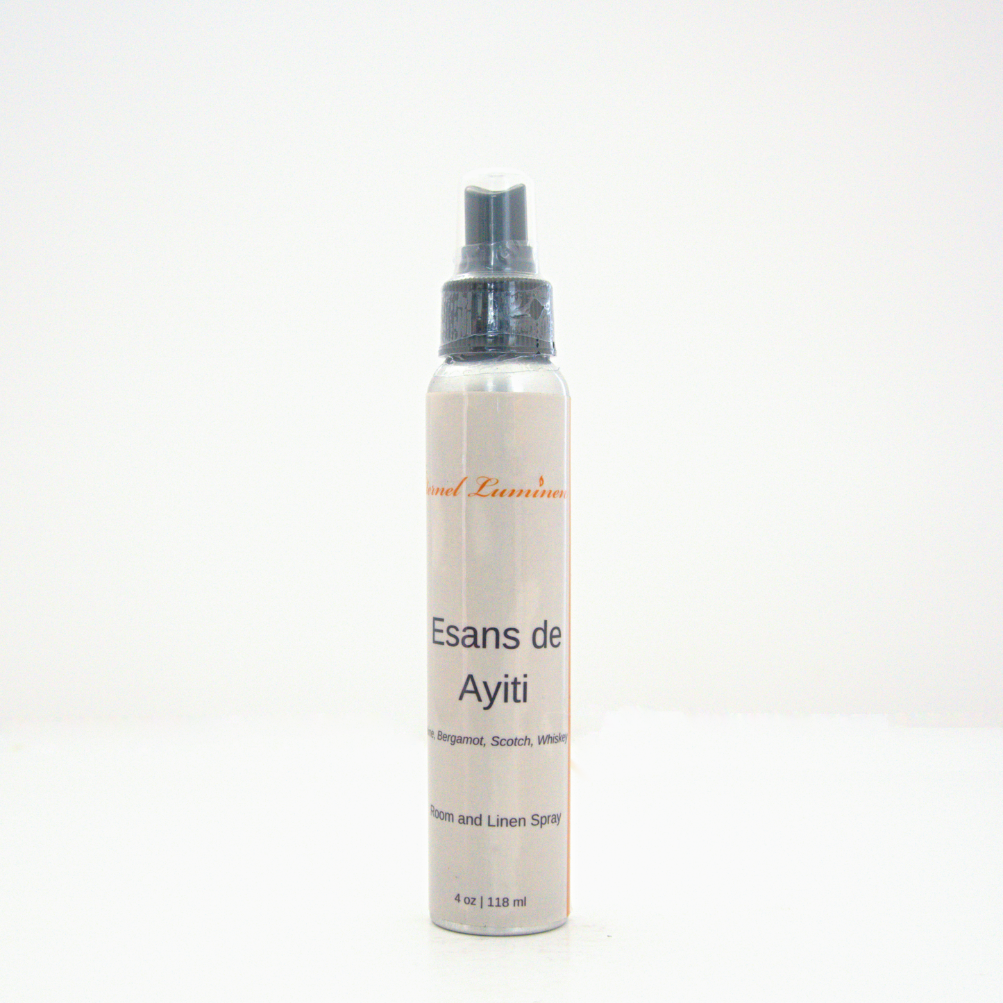 A 4oz Esans de Ayiti room & linen spray sitting against a white background made by Eternel Luminen.