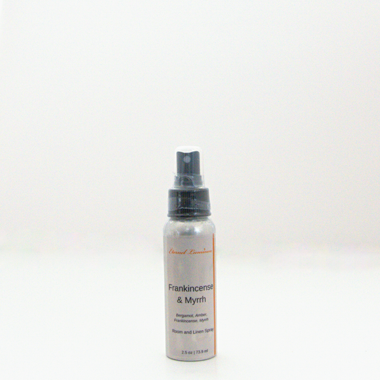 A 2.5oz Frankincense & Myrrh room & linen spray sitting against a white background made by Eternel Luminen. 