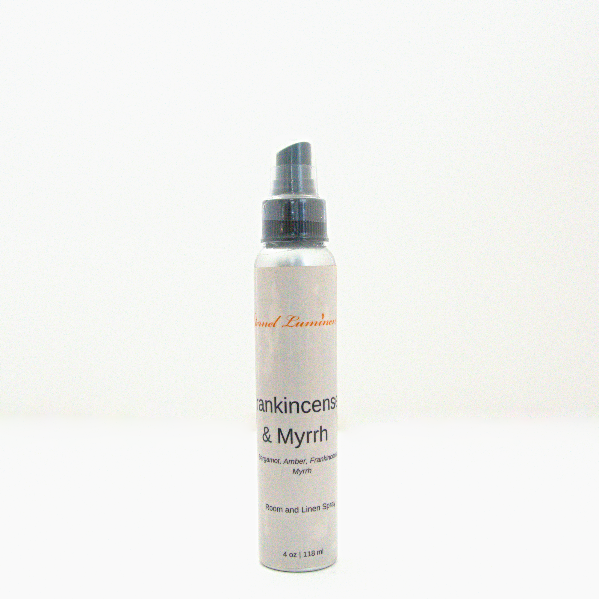 A 4oz Frankincense & Myrrh room & linen spray sitting against a white background made by Eternel Luminen.