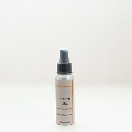 A 2.5oz French Lilac room & linen spray sitting against a white background made by Eternel Luminen. 