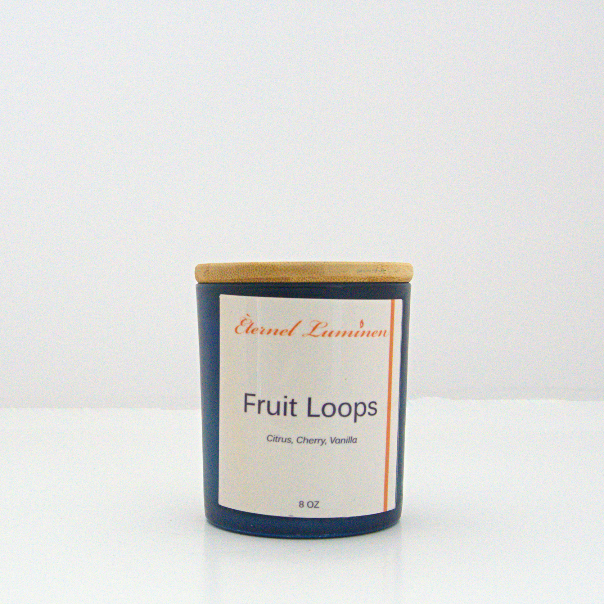 A 8 oz Fruit Loops frosted candle with a wooden lid sitting against a white background made by Eternel Luminen.