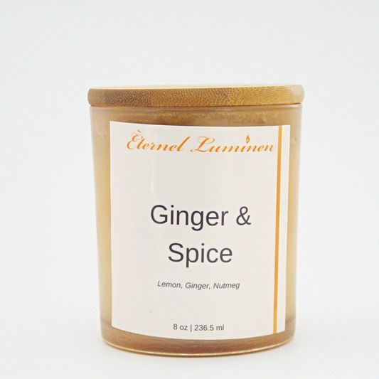 A 8 oz Ginger & Spice frosted candle with a wooden lid sitting against a white background