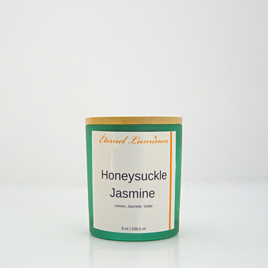 A 8 oz Honeysuckle Jasmine frosted candle with a wooden lid sitting against a white background made by Eternel Luminen.