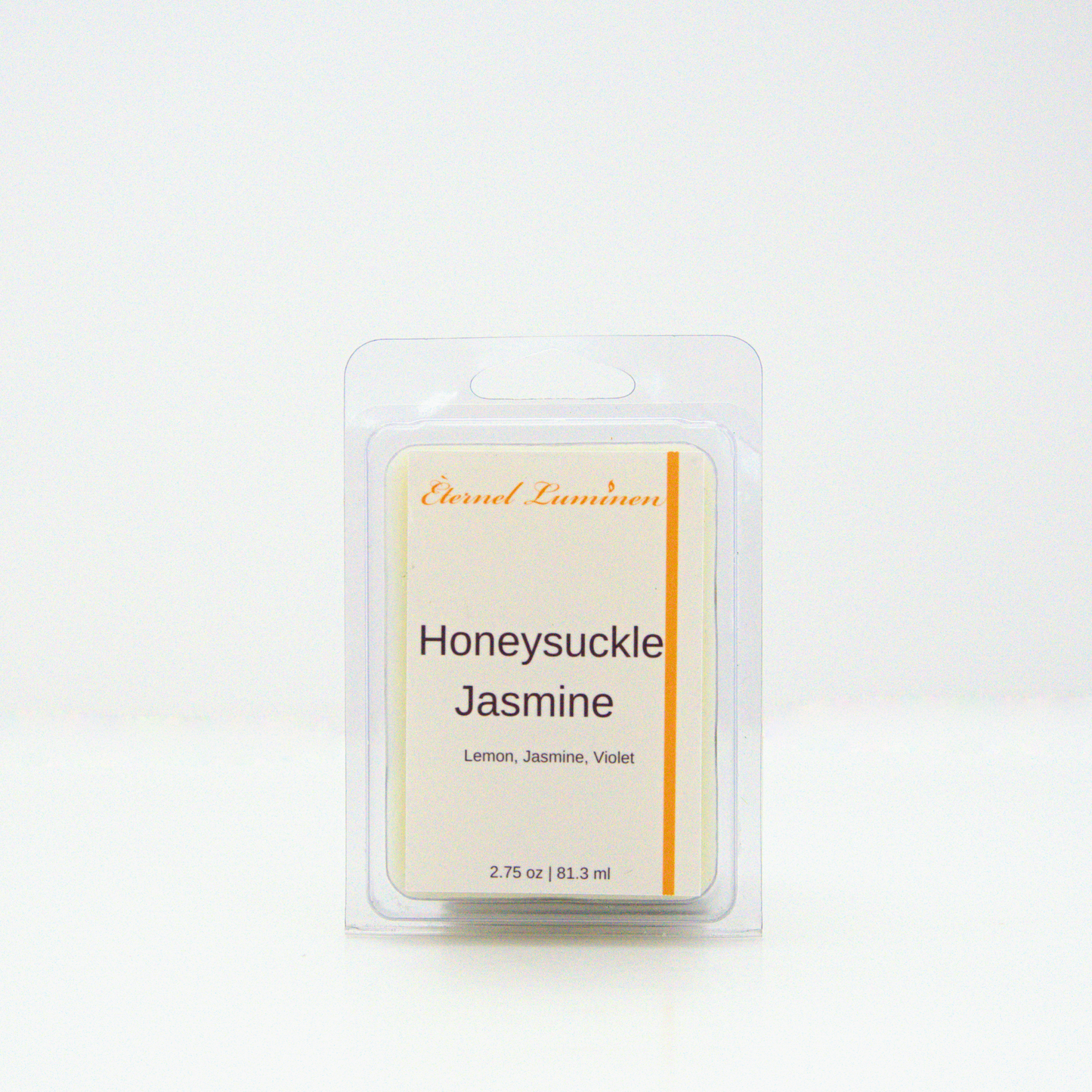 A 2.75 oz, 6 cube, honeysuckle jasmine wax melt sitting against a white background made by Eternel Luminen.