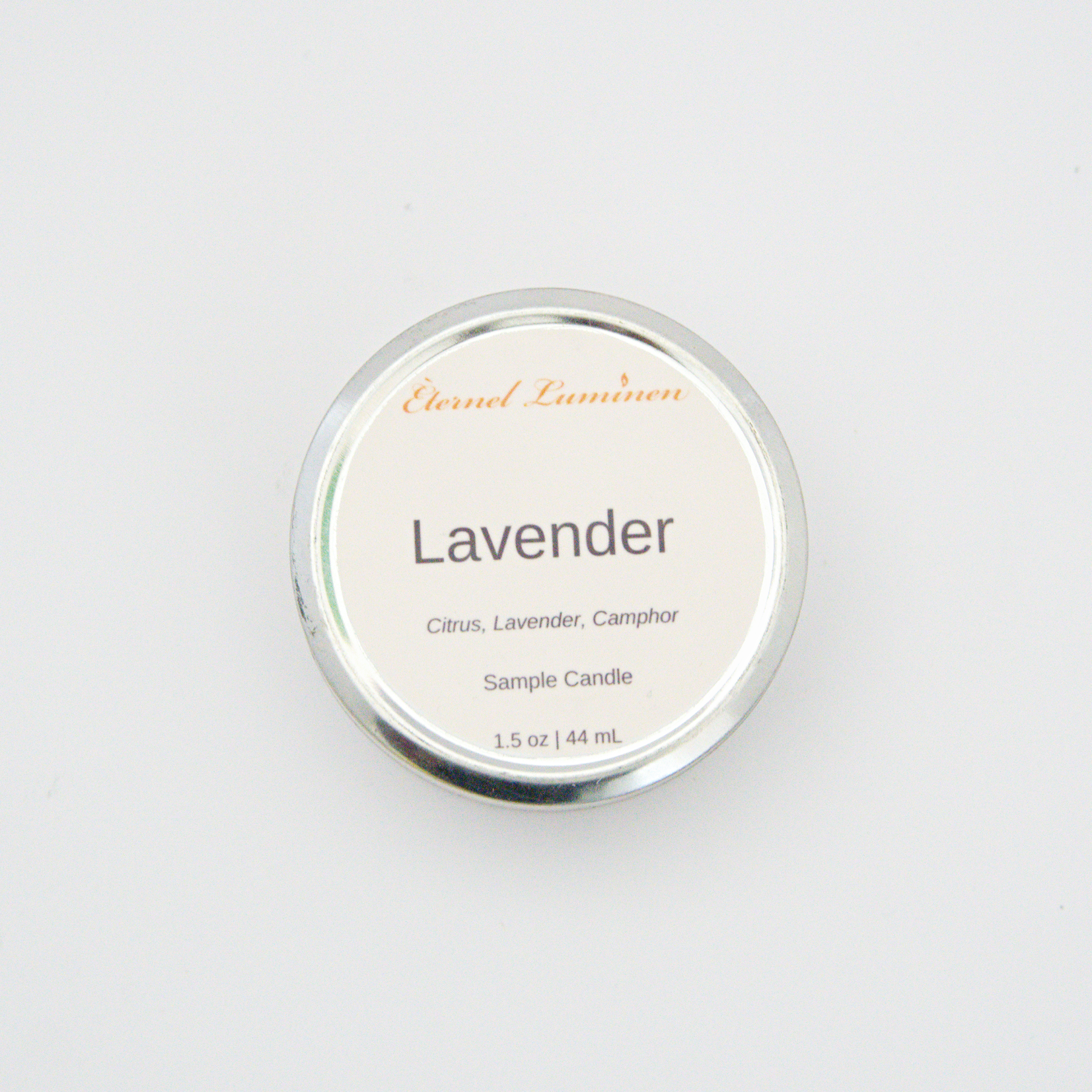 A 1.5oz Lavender sample candle in a tin jar sitting against a white background