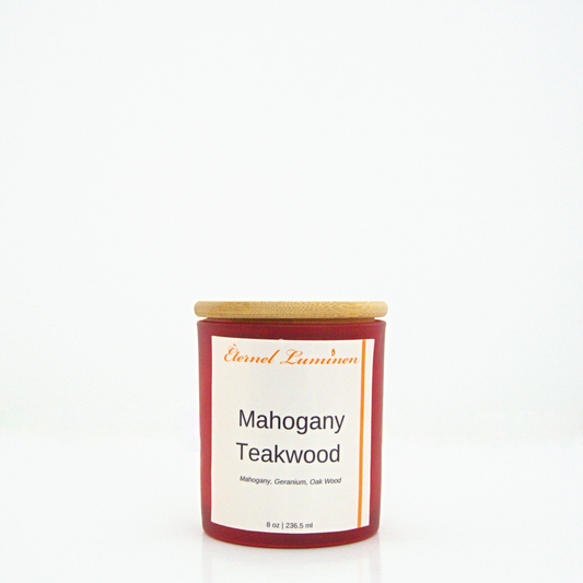 A 8 oz Mahogany Teakwood frosted candle with a wooden lid sitting against a white background made by Eternel Luminen.