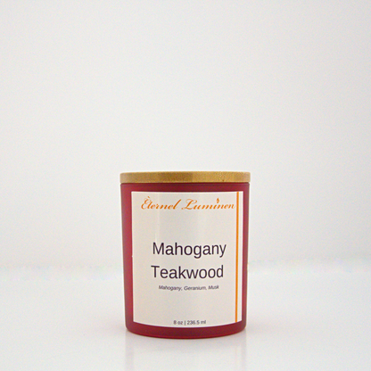 A 8 oz Mahogany Teakwood frosted candle with a wooden lid sitting against a white background made by Eternel Luminen.