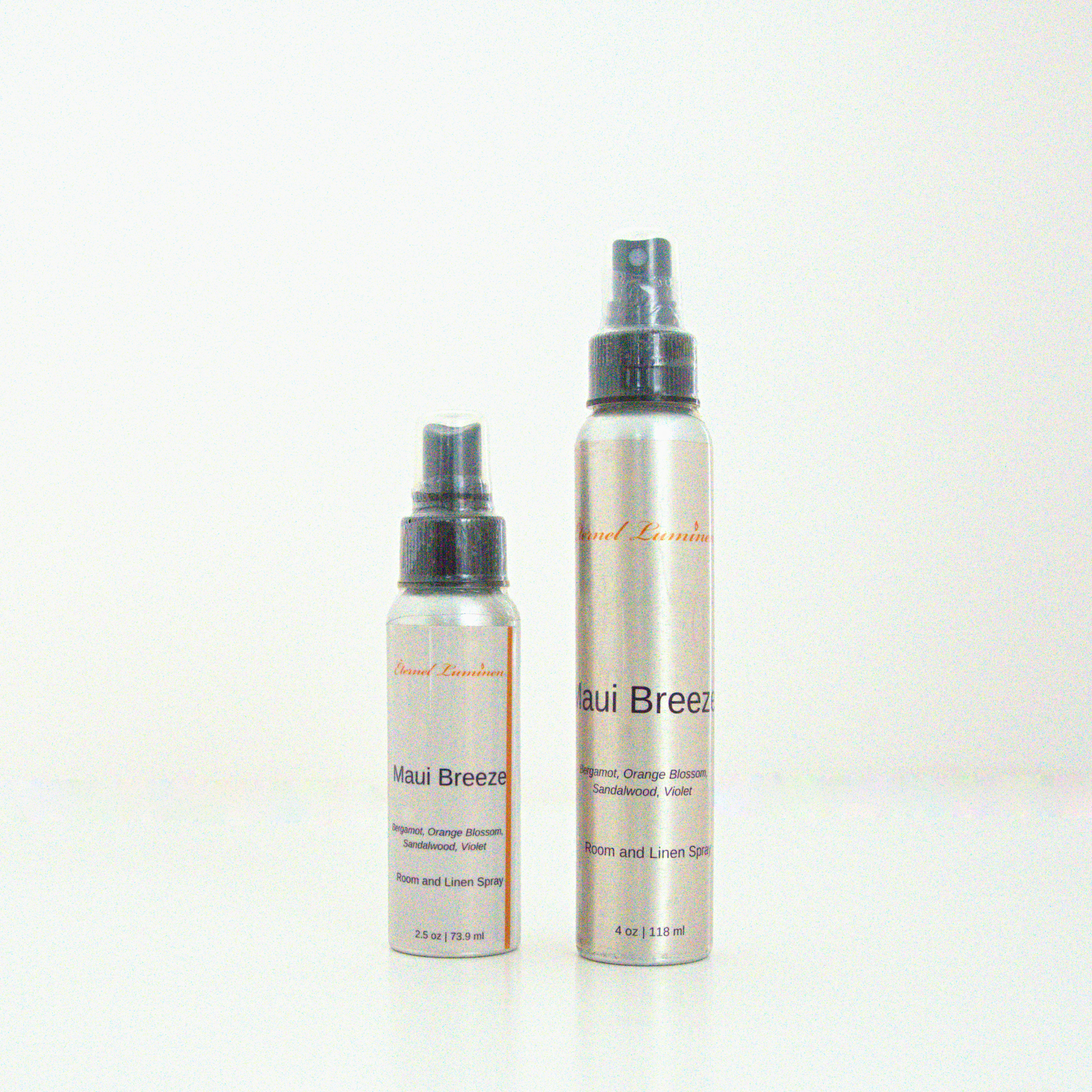 A 2.5oz & 4oz Maui Breeze room & linen spray sitting against a white background made by Eternel Luminen. 