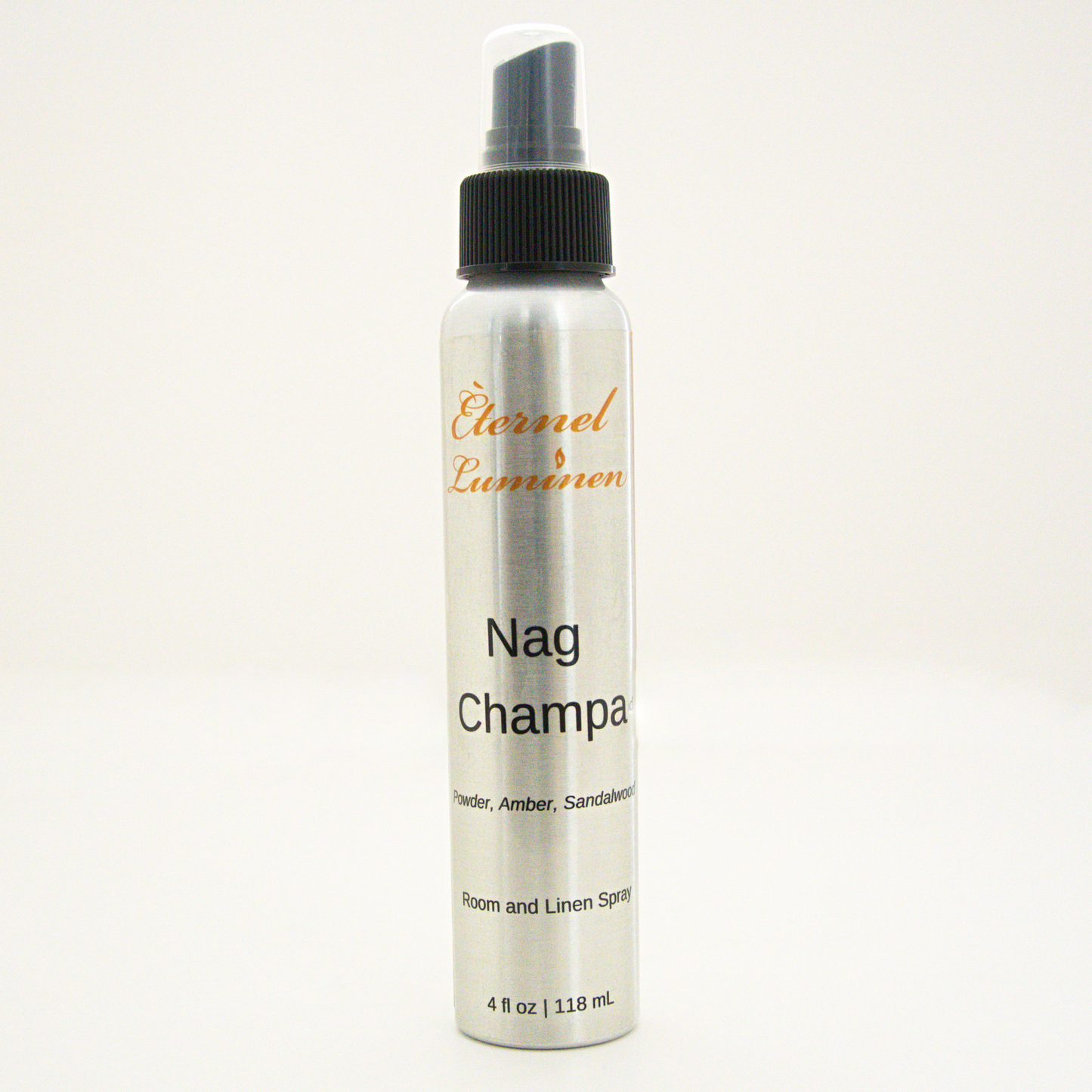 A 4oz Nag Champa room & linen spray sitting against a white background made by Eternel Luminen. 
